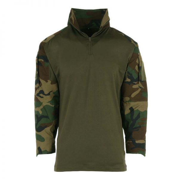 131400 Tactical shirt UBAC woodland <big>Tactical shirt Woodland van 65% Polyester / 35% Katoen Ripstop en 100% Polyester.</big> <strong>Kenmerken:</strong> <ul> <li><big>Under Body Armour Combat Shirt, gemaakt voor het dragen onder het balistisch vest.</big></li> <li><big>Optimaal draag comfort, de armen zijn als een normale gevechtsjas opgemaakt van 50/50 NyCo Rip Stop en als extra voorzien van versterkte ellebogen.</big></li> <li><big>2 opgezette armzakken met Velcro vlakken en opbergzak met ritssluiting.</big></li> <li><big>Versterkte elleboogvlakken. </big></li> <li><big>Contour ontworpen polsen met Velcro sluiting.</big></li> </ul>
